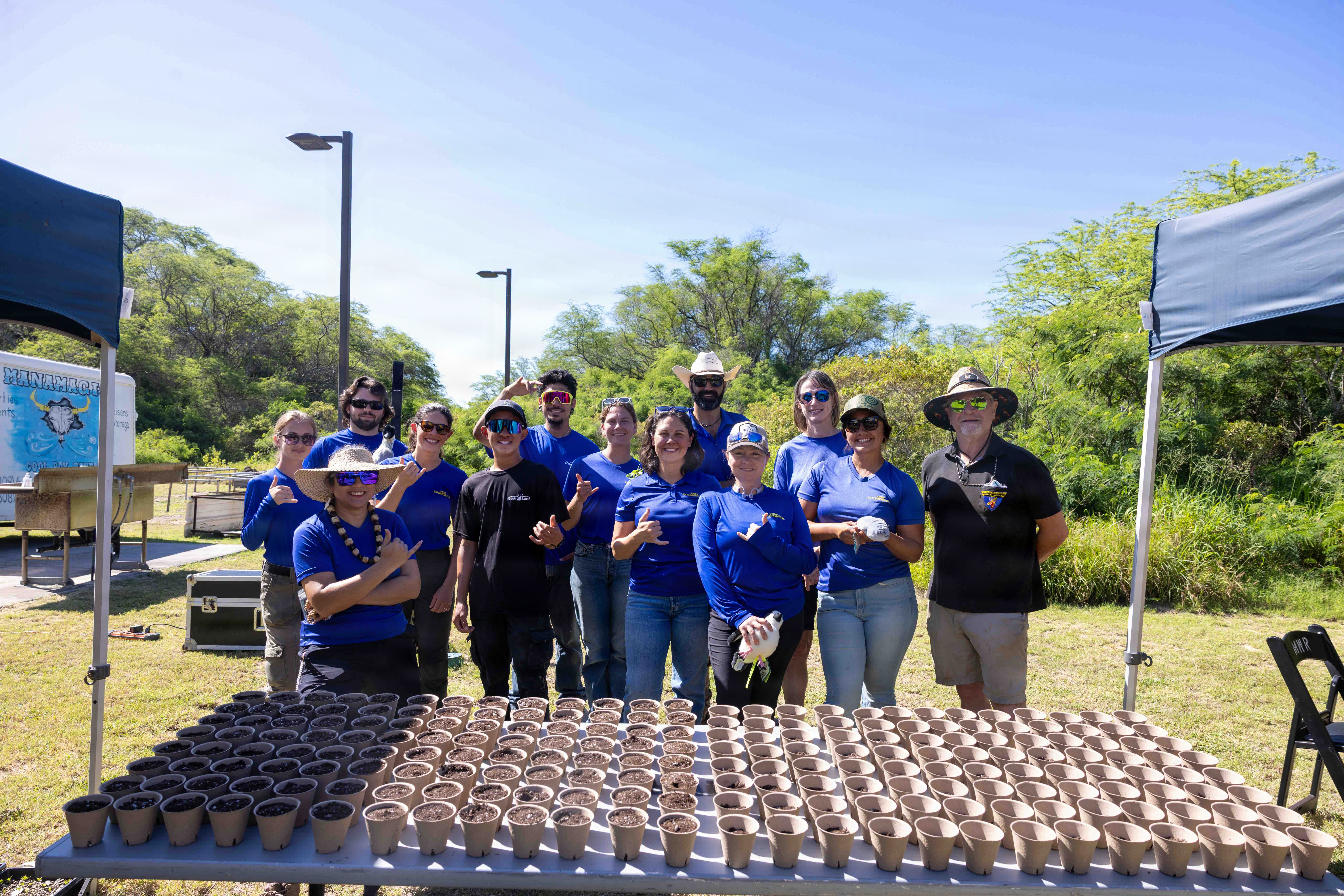 The PMRF Natural Resources team poses for a photo during West Kaua'i schools' annual field trip to the base.